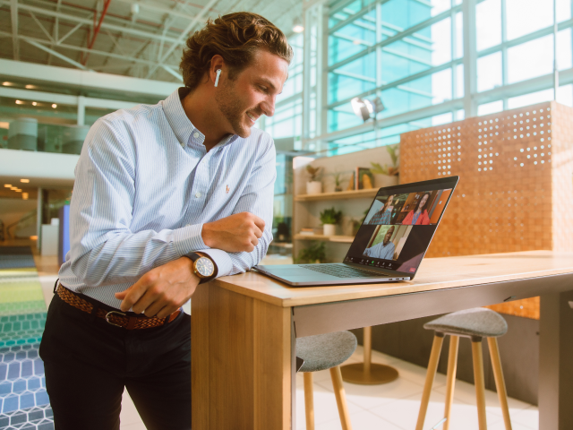 Man standing at laptop